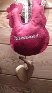 a pink chicken with the word elegance written on it at Le Solé Bassurois in Basse-sur-le-Rupt