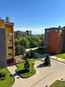 an aerial view of a city with buildings and trees at Apartament Birutes 22 in Klaipėda