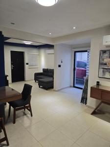a living room with a couch and a table at Apartment with separate parking in Heroica Nogales