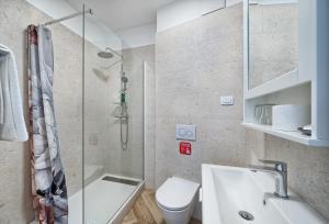 a bathroom with a shower and a sink and a toilet at STELLA'S BEACHFRONT - Aparthotel - FREE PARKING in Split +89 photos
