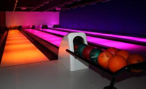 a row of bowling lanes in a game room at EuroParcs Schoneveld in Breskens