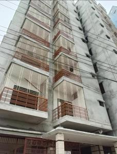 a building with bars on the windows of it at Airport Bliss Residence in Chandālbhog