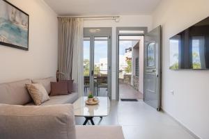 a living room with a couch and a table at Antonias Serenity in Loutra