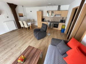 a living room with a couch and a table at Wattenmeer-Ferien in Süllwarden