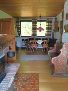 a living room with a couch and a table at Chalet Glauninger in Ramsau am Dachstein