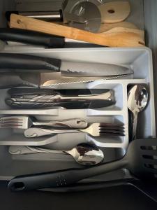a drawer filled with lots of utensils at Entre Rivière et Sommets in Seix