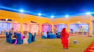 a group of people sitting in a tent at Prem Garden in Bhiwāni