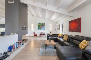 a living room with a couch and a table at Villa de Lujo Cerca de Sitges in Sant Pere de Ribes