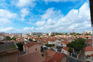 a view of a city with houses and buildings at La bulle canetoise - vue mer in Canet-en-Roussillon