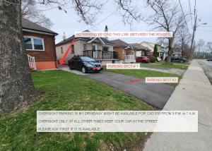 a house with a sign that reads no parking behind this house between the trees at Affordable Quiet Private Room - 10-min Walk to Subway in Toronto