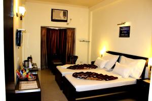 Voodi või voodid majutusasutuse Hotel Hong Kong Inn toas