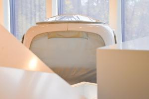 a toilet seat in a room with a window at One Night in a Museum - LUNA Sleep Cube in Lüneburg