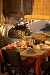 a table with fruits and vegetables on a table at Antica Terrazza in Morciano di Leuca