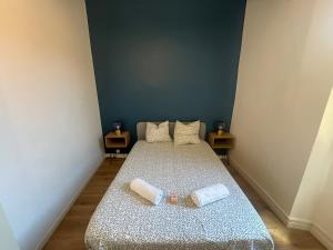 a bedroom with a bed with two pillows on it at Le Nomad - Perpignan center in Perpignan +21 photos
