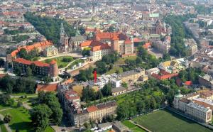 an overhead view of a city with buildings and trees at Apartment Bernardynska in Krakow