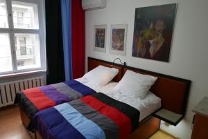 Postel nebo postele na pokoji v ubytování Rooms Bytom