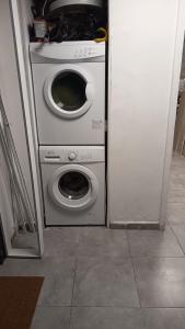 a washing machine and a washer in a room at City tower 16 floor in Jerusalem +3 photos
