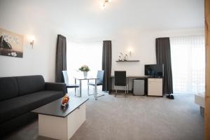 TV a/nebo společenská místnost v ubytování Hotel Alt Riemsloh