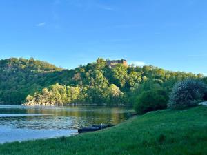 a view of a lake with a castle on a hill at Na Špici Bítov in Bítov