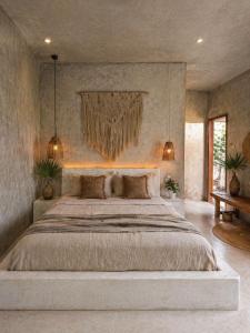 a bedroom with a large bed in a room at Alba Villa in Gili Trawangan