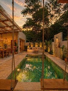 a swimming pool in the middle of a yard at Alba Villa in Gili Trawangan