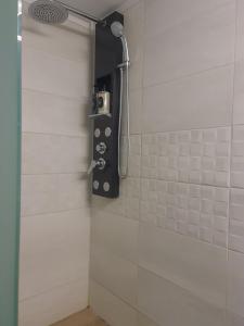 a shower with a shower head in a bathroom at Rhódia & Sun by Booking Kottas in Ixia