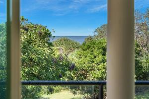 a view of the ocean from a window at Surfside in East Ballina