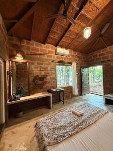 a large room with a bed and a mirror at Atithi Parinay Homestay in Ratnagiri