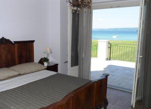 a bedroom with a bed and a view of the ocean at Azienda Agricola Melona in Bolsena