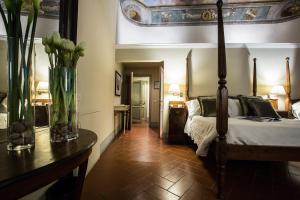 Postel nebo postele na pokoji v ubytování Hotel Burchianti