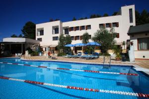 a large swimming pool in front of a building at AgriCostella Agriturismo Vieste in Vieste