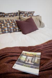 a book sitting on top of a bed at Charlie Browns Clyde Studio in Clyde