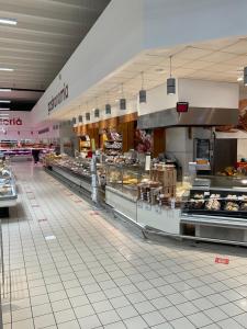 a large kitchen in a store with a lot of food at Oasis Blue Resort - Hotel & Residenz Apartments Strandnähe in Caorle