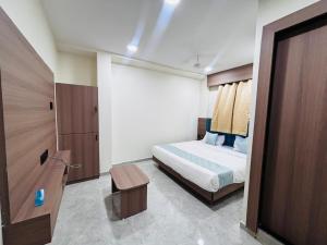 เตียงในห้องที่ Hotel Mb Prime