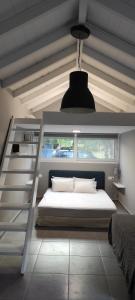 a bedroom with a bunk bed and a window at Lea's Studio in Kourouta