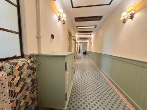 a hallway of a hospital with a tile floor at The Chambers Georgetown in George Town