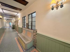 a hallway with a bench in a building at The Chambers Georgetown in George Town