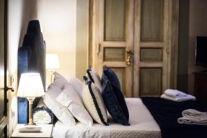 Postel nebo postele na pokoji v ubytování Hotel Burchianti