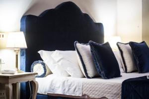 Postel nebo postele na pokoji v ubytování Hotel Burchianti
