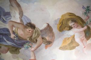 a painting of a angel and a child on a ceiling at Hotel Burchianti in Florence
