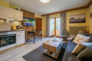 a living room with a couch and a table at Landler Auszeit in Thiersee