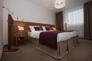 Posteľ alebo postele v izbe v ubytovaní Hotel Metropol