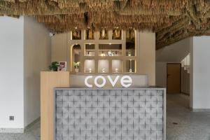 a store with a sign on top of a counter at Cove Vaia in Bandung