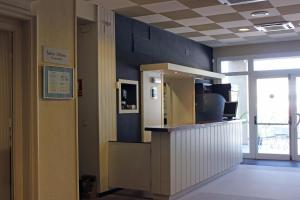 an office lobby with a counter in a room at Puerta De España in La Jonquera