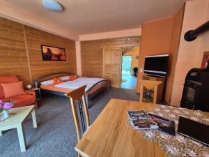 a bedroom with a bed and a living room at Apartments Schramm in Eisenach