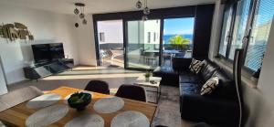 a living room with a couch and a table at Dinary Apartman in Vir