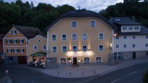 a large building with a cross on top of it at Hotel Alt-Oberndorf in Oberndorf bei Salzburg