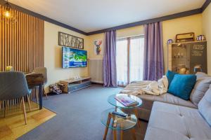 a living room with a couch and a table at Landler Auszeit in Thiersee