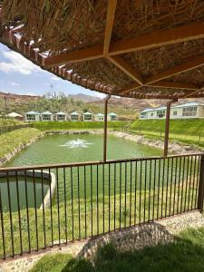 a view of a river from a balcony at منتجع خيال رفيف in Ḩarshaf