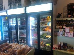 a refrigerator with its doors open in a store at The Ship Aground Woolacombe in Woolacombe